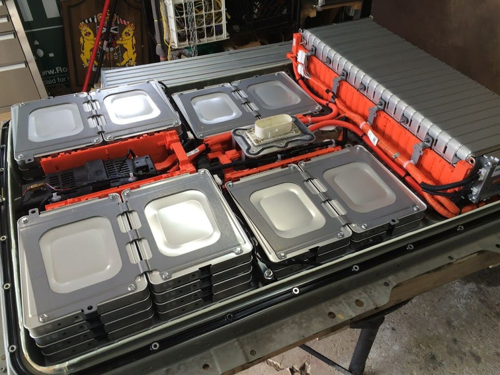 Electric-vehicle battery assembly opened for inspection