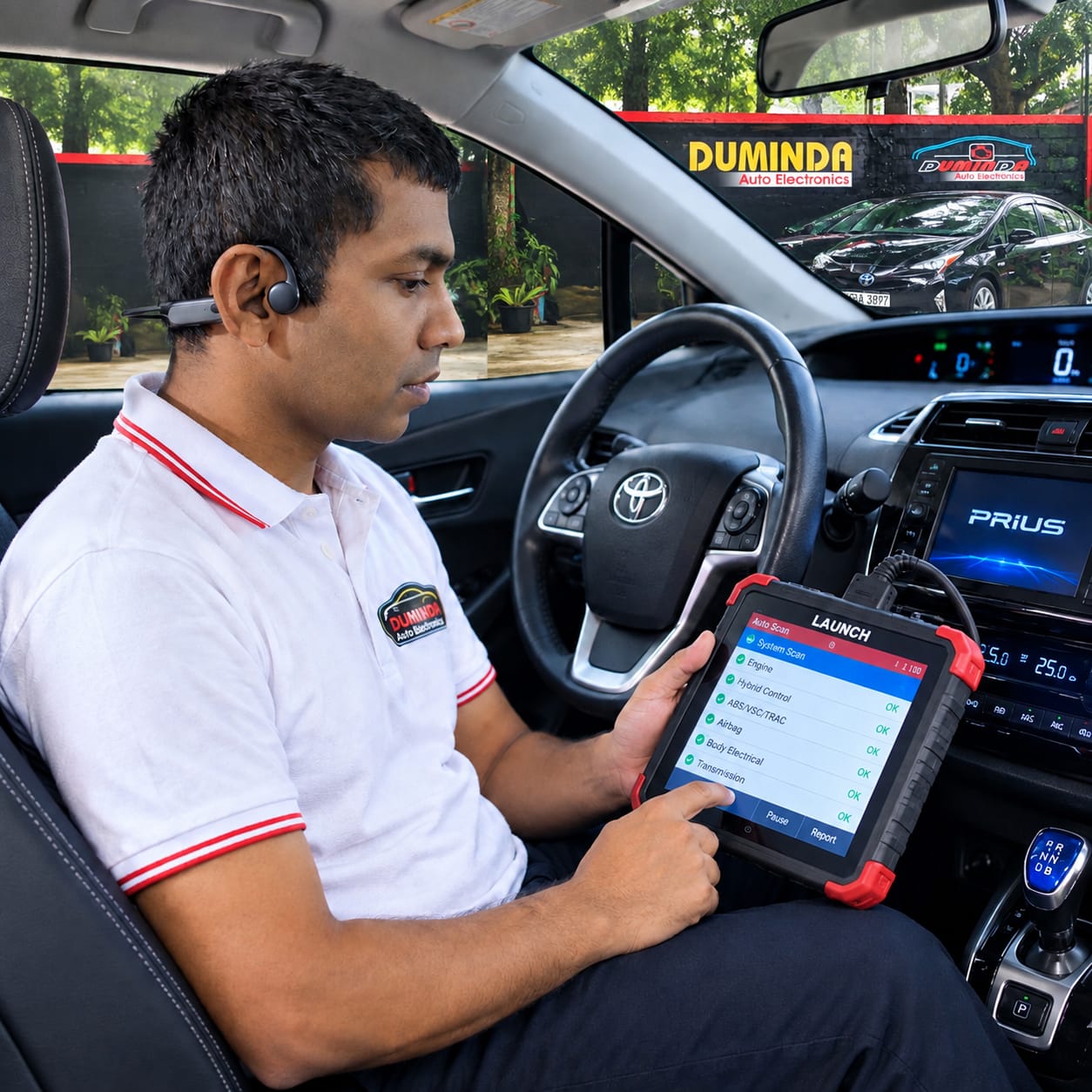 Duminda using a diagnostic scanner inside a vehicle